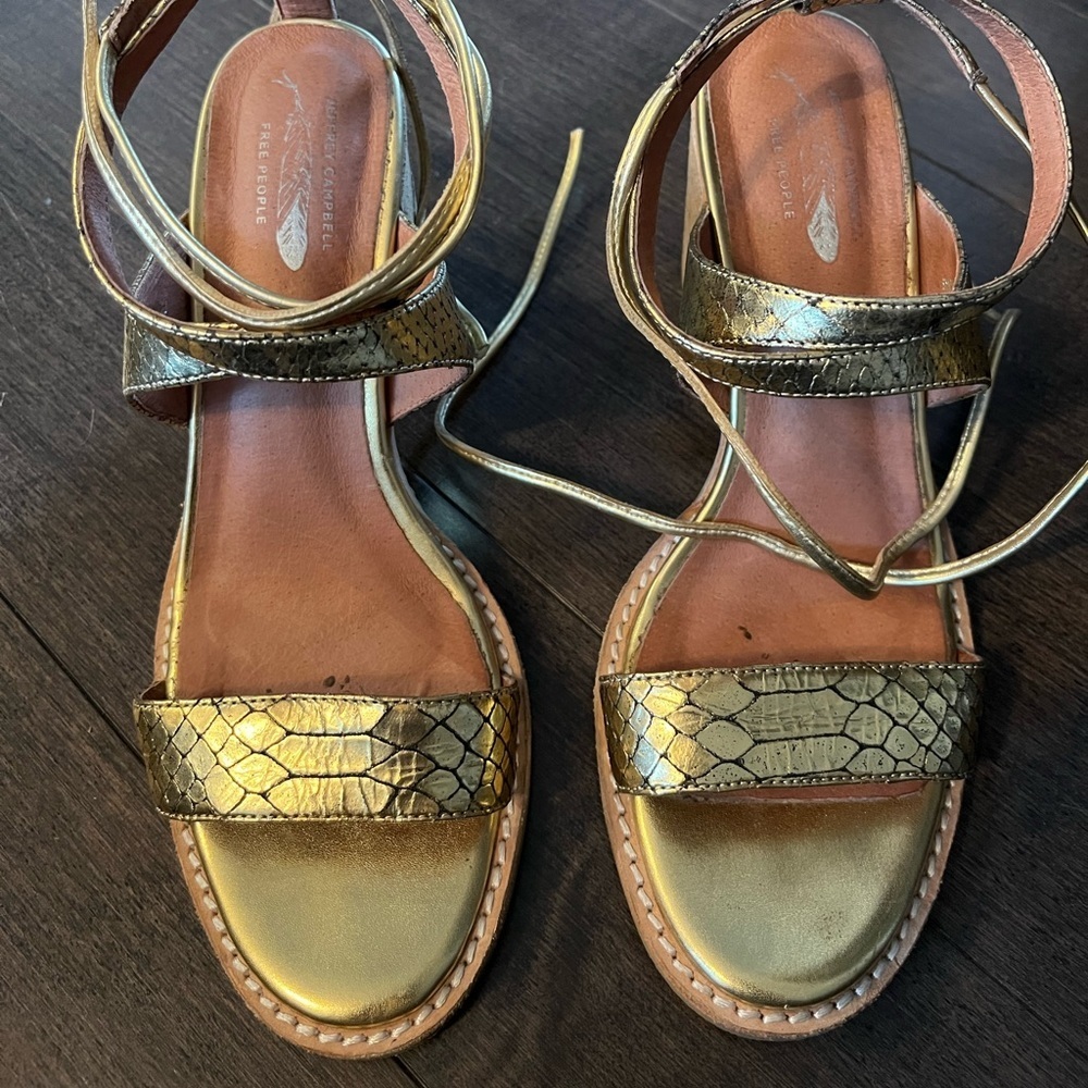 Jeffrey Campbell x Free People gold tie up heeled sandals.